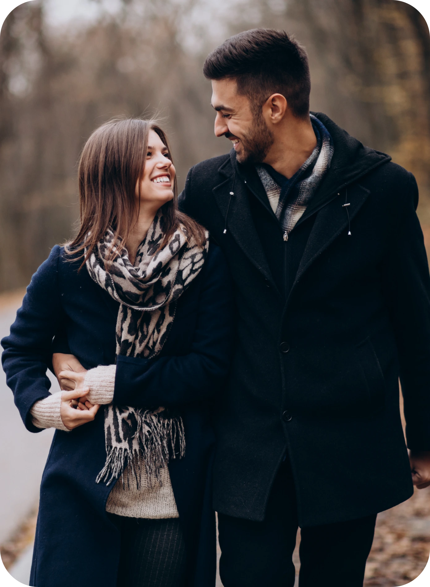 Young couple walking in autumn park
